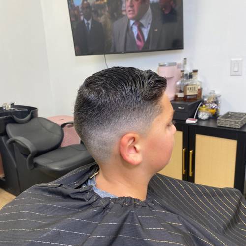 Short men’s haircut with a tapered finish