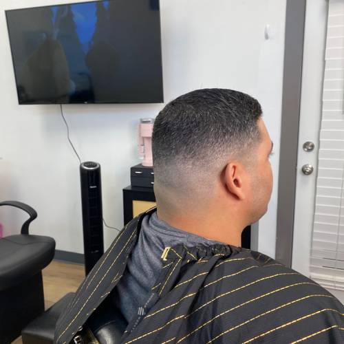 Clean fade haircut by Meagen Rose